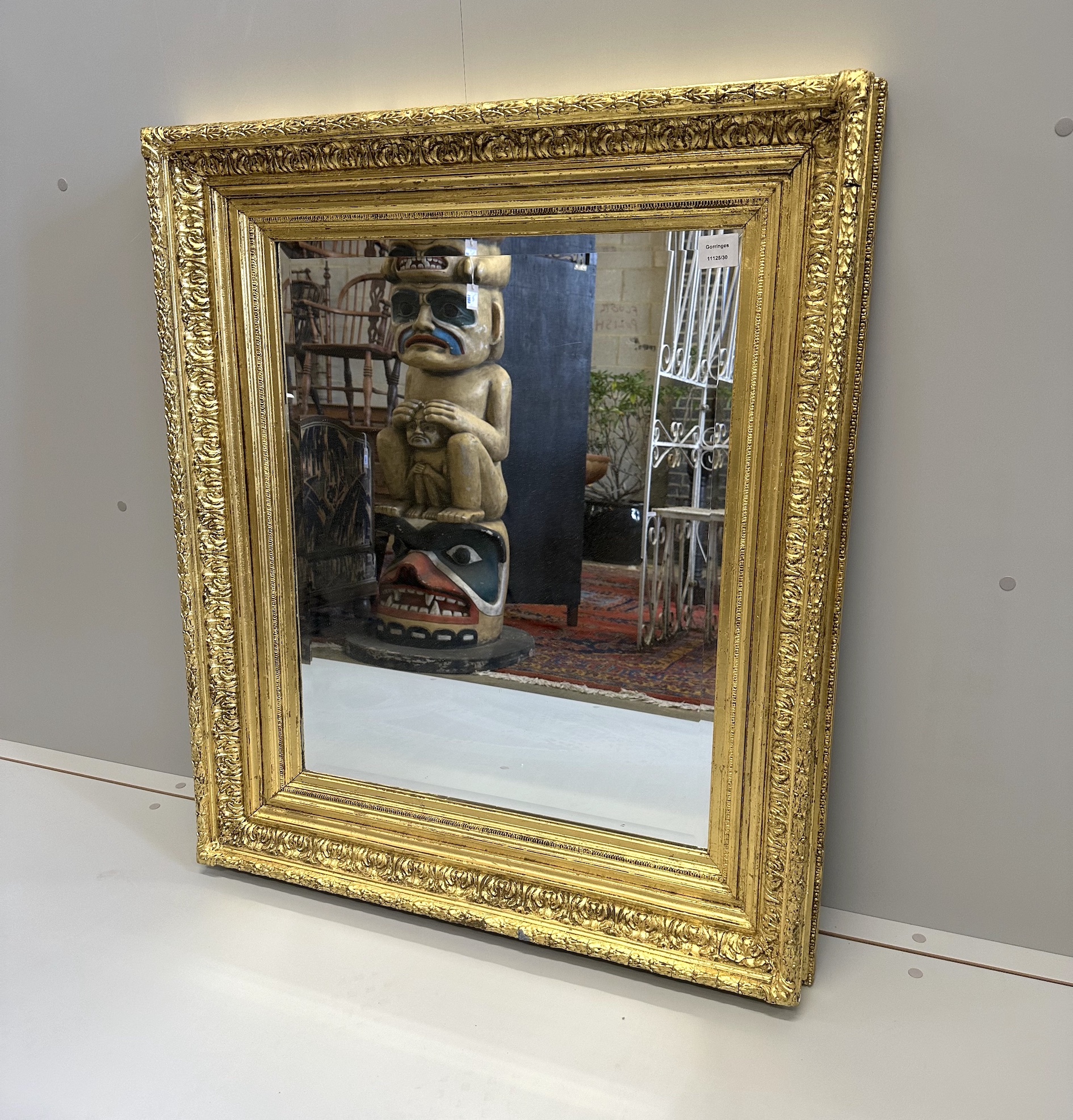 A Victorian giltwood and composition 'picture frame’, now as a wall mirror, width 82cm, height 95cm